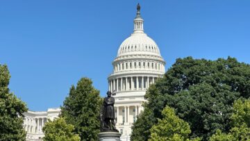 U.S. Capitol dome with a statue of James A. Garfield in the foreground